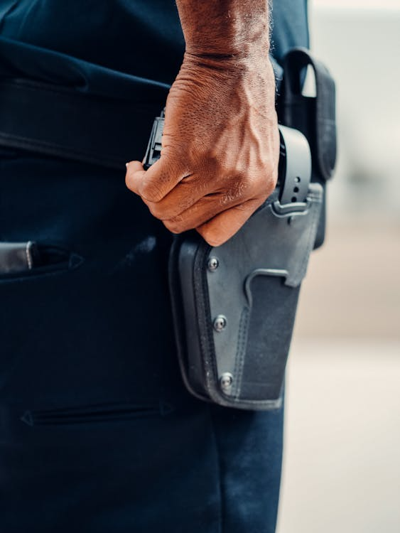 An armed guard with a gun.