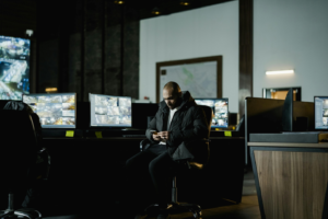 A security guard sitting a security room
