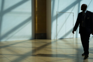 A security guard patrols his workplace.