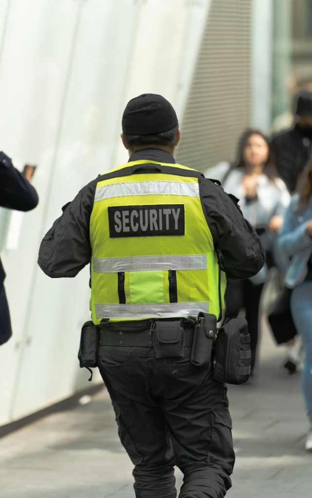 A security professional walking in a residential area.