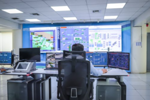 Operator in a modern control room managing surveillance systems