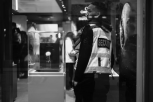 Black-and-white picture of a security guard in a vest