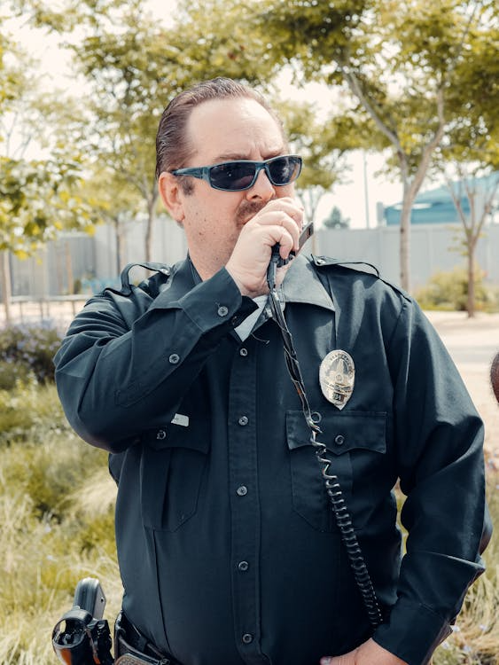 Professional security team member communicating over a radio 